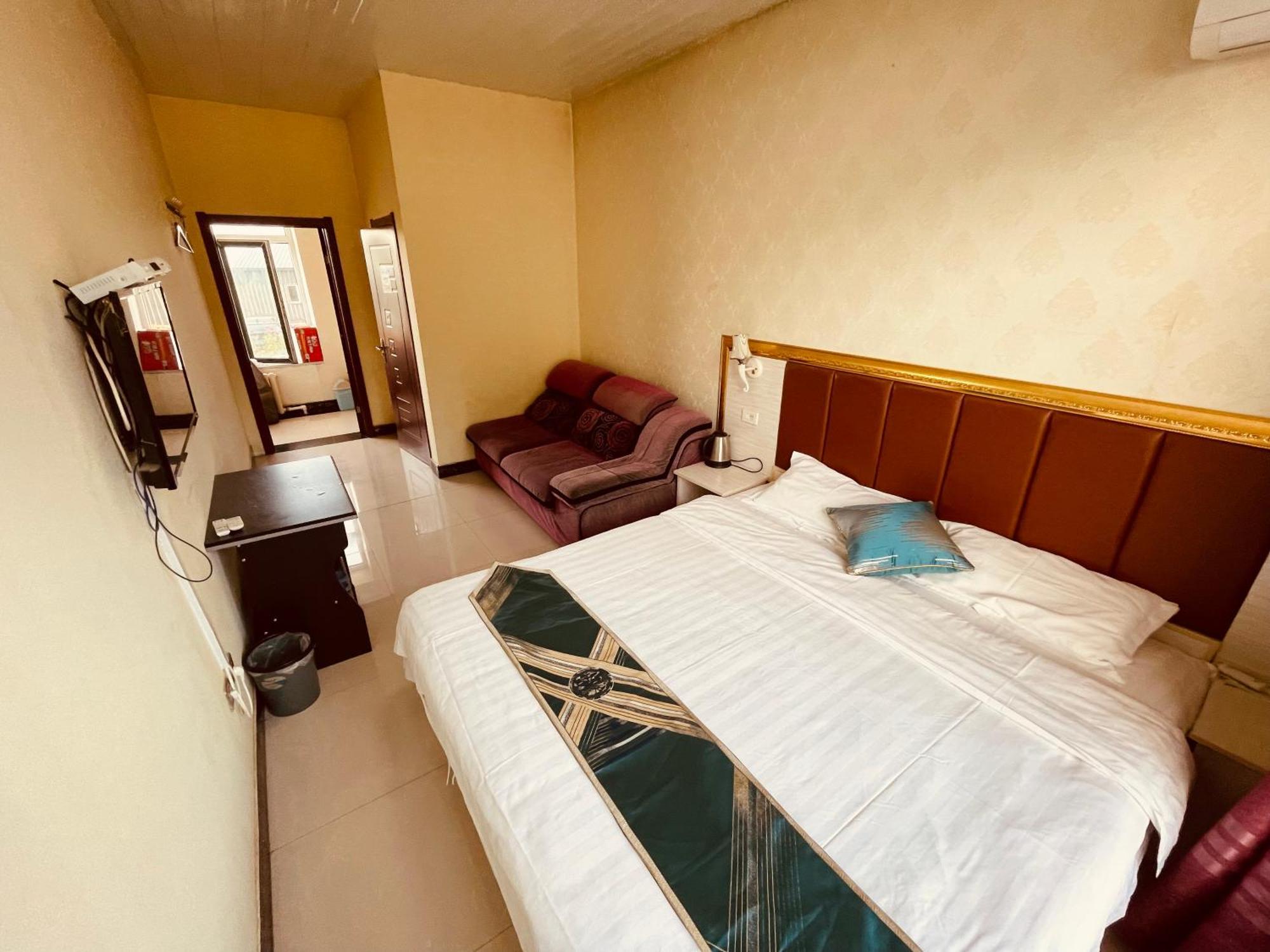 哈尔滨机场东方红运宾馆 Hotel Quarto foto