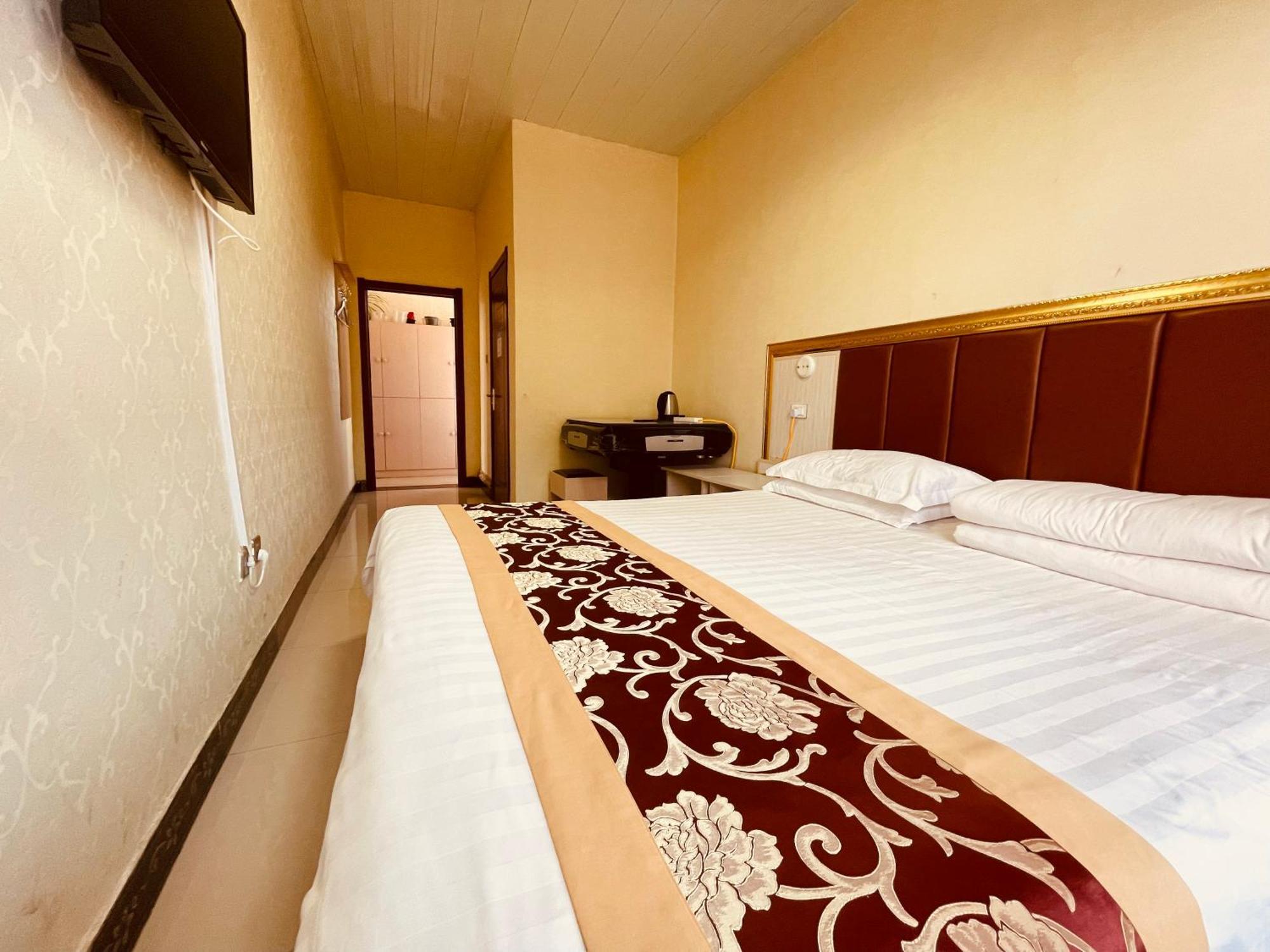 哈尔滨机场东方红运宾馆 Hotel Quarto foto